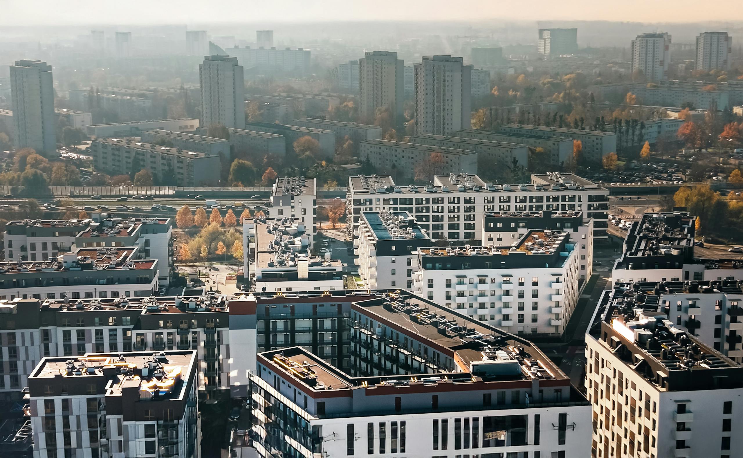 Aerial view of modern apartments in PoznaĆ, showcasing urban living and architecture.